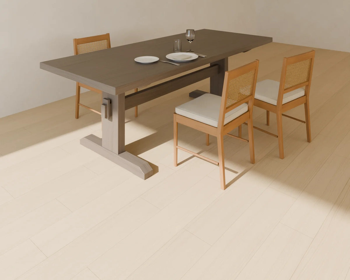 Cane-Back Dining Chair styled in a Linden House room with the trestle dining table and place setting (sold separately)