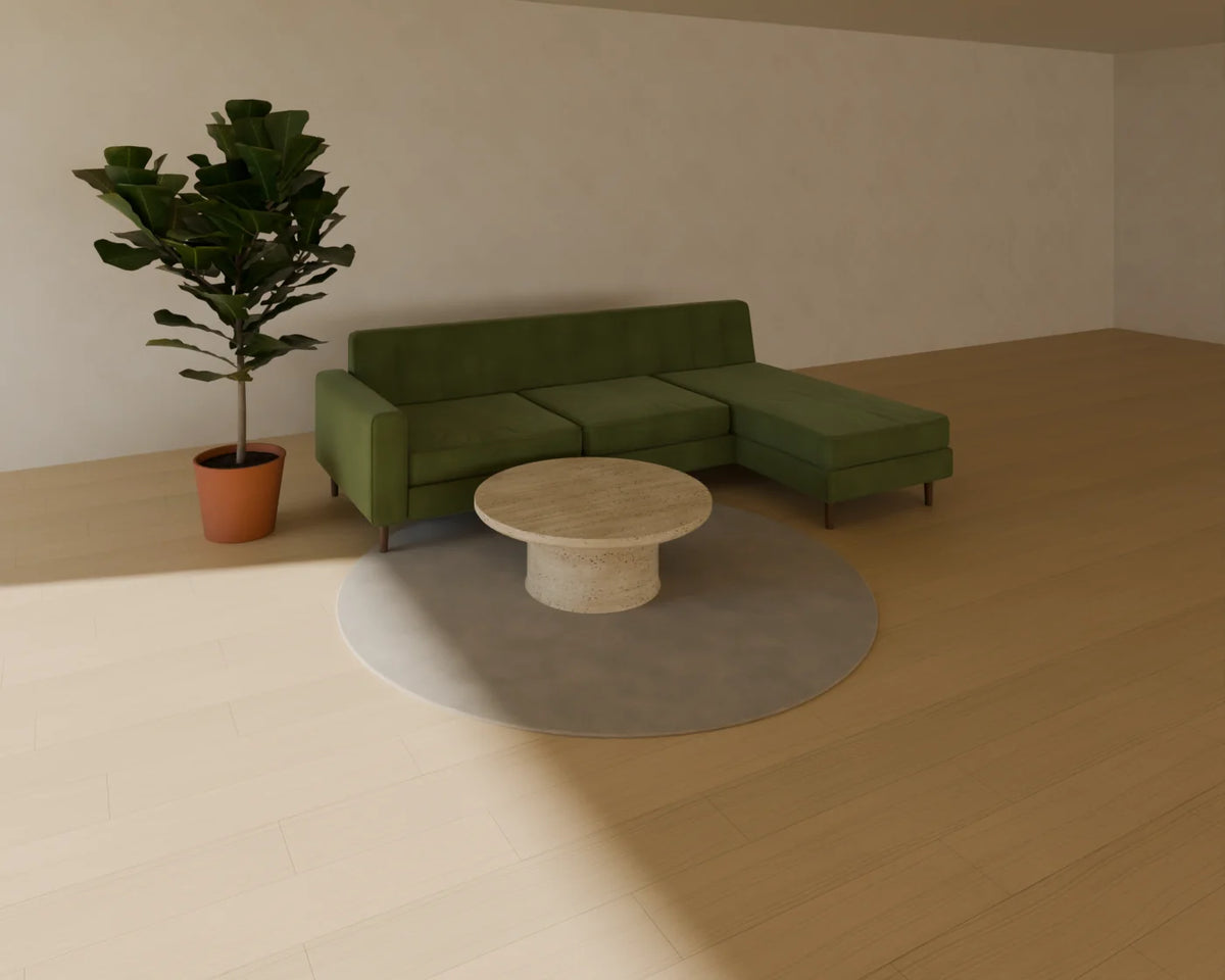 Chaise Sofa styled in a Linden House room with the round rug, round stone coffee table and fiddle-leaf fig in planter (sold separately)
