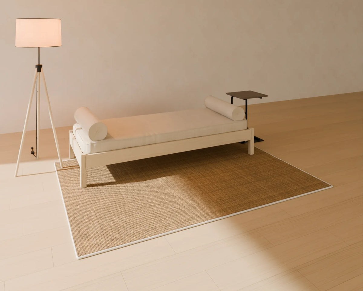 Upholstered Daybed styled in a Linden House room with the jute rug, c-shaped side table and tripod floor lamp (sold separately)