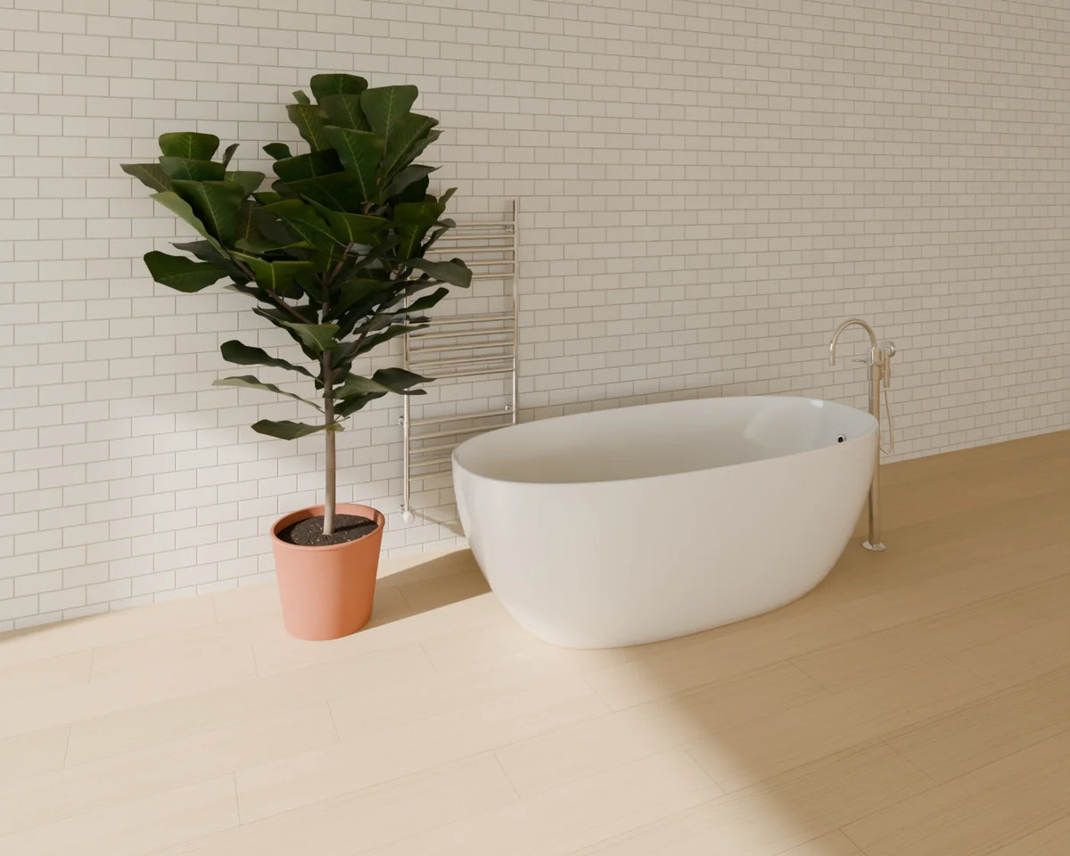 Freestanding Bathtub styled in a Linden House room with the freestanding bath filler, heated towel rail and fiddle-leaf fig in planter (sold separately)