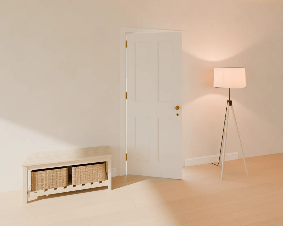 Four-Panel Interior Door styled in a Linden House room with the skirting board, tripod floor lamp and hallway storage bench (sold separately)