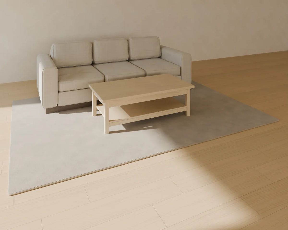 Rectangular Coffee Table styled in a Linden House room with the three-seat sofa and tufted wool rug (sold separately)