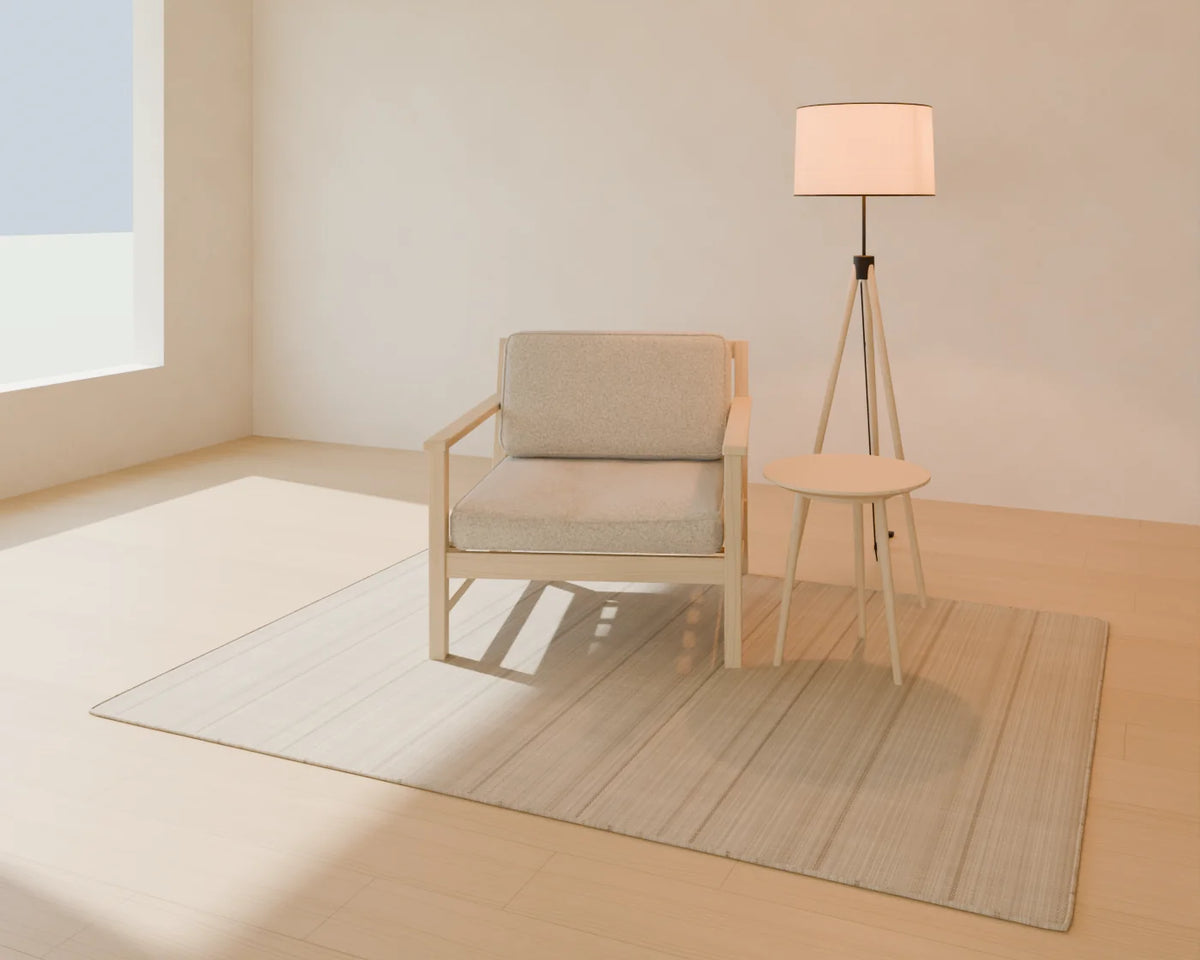 Round Side Table styled in a Linden House room with the lounge armchair, tripod floor lamp and flatweave wool rug (sold separately)