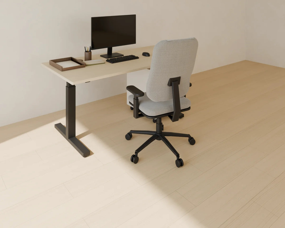 Sit-Stand Desk styled in a Linden House room with the ergonomic office chair, monitor and keyboard, filing pedestal and desk accessories set (sold separately)
