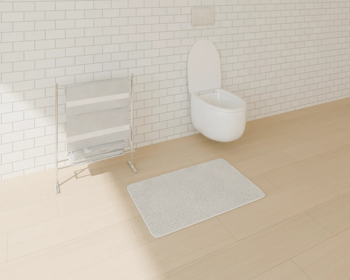 Bath Towel Set styled in a Linden House room with the bath mat and wall-hung toilet (sold separately)