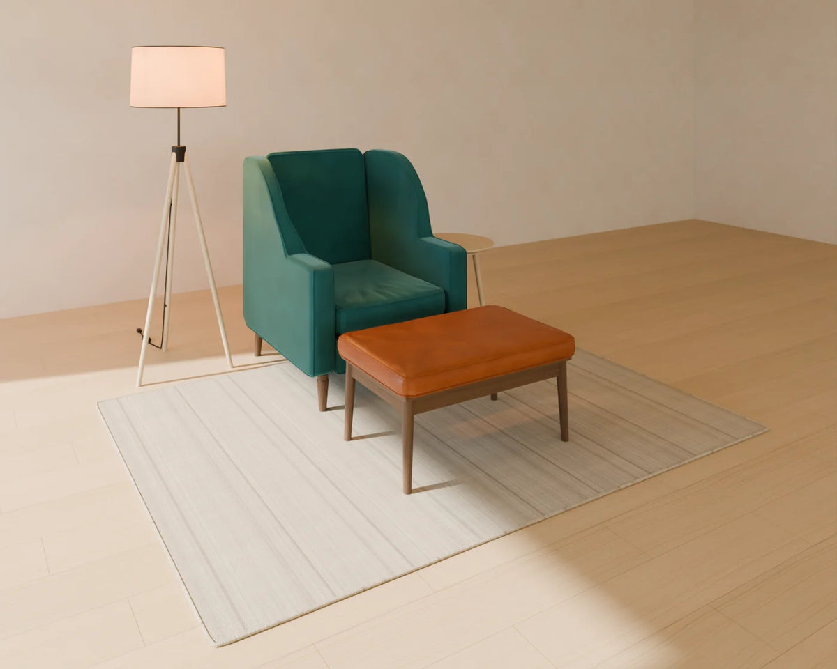 Wingback Armchair styled in a Linden House room with the upholstered footstool, round side table, tripod floor lamp and flatweave wool rug (sold separately)