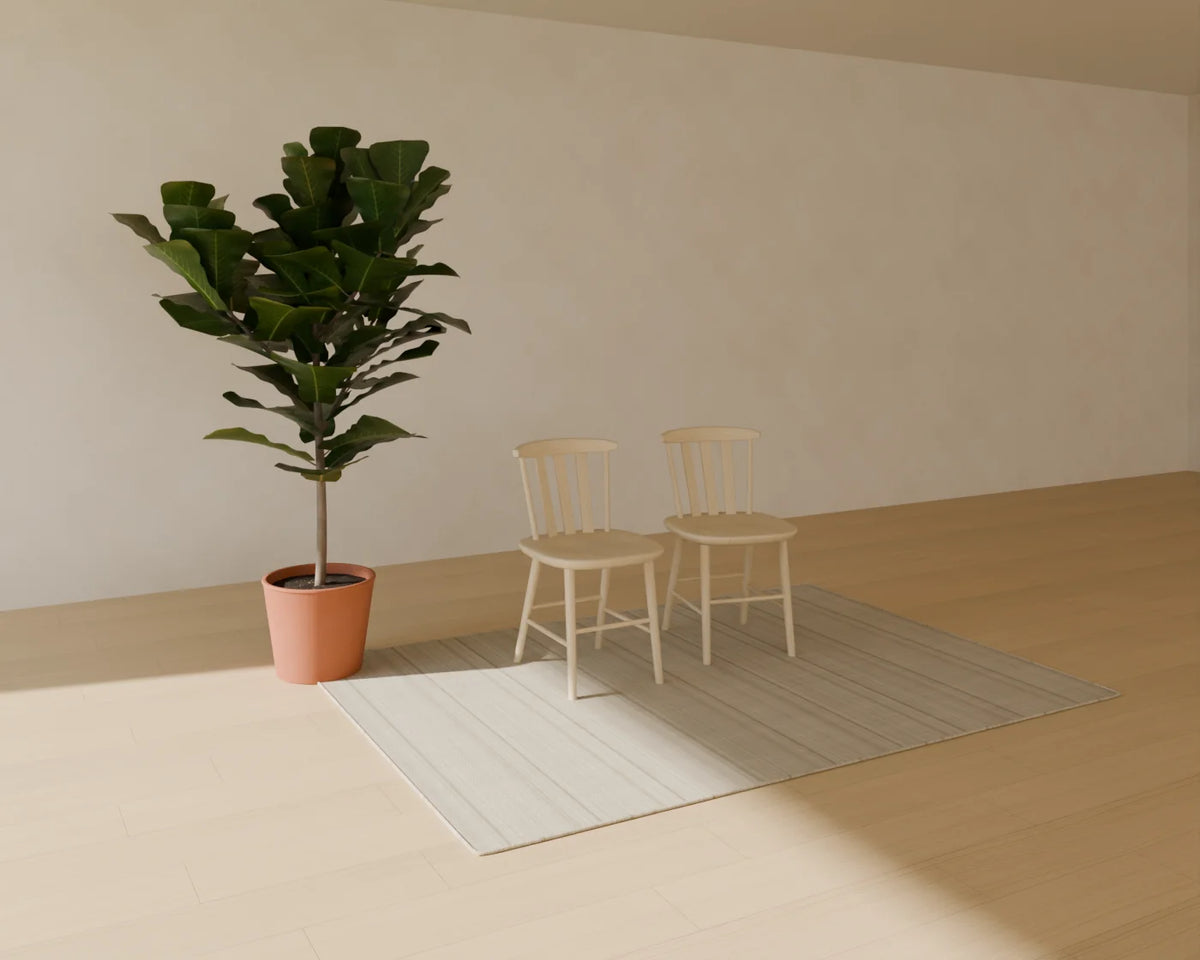 Wood Dining Chair styled in a Linden House room with the flatweave wool rug and fiddle-leaf fig in planter (sold separately)
