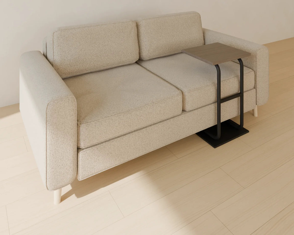 C-Shaped Side Table styled in a Linden House room with the two-seat sofa (sold separately)