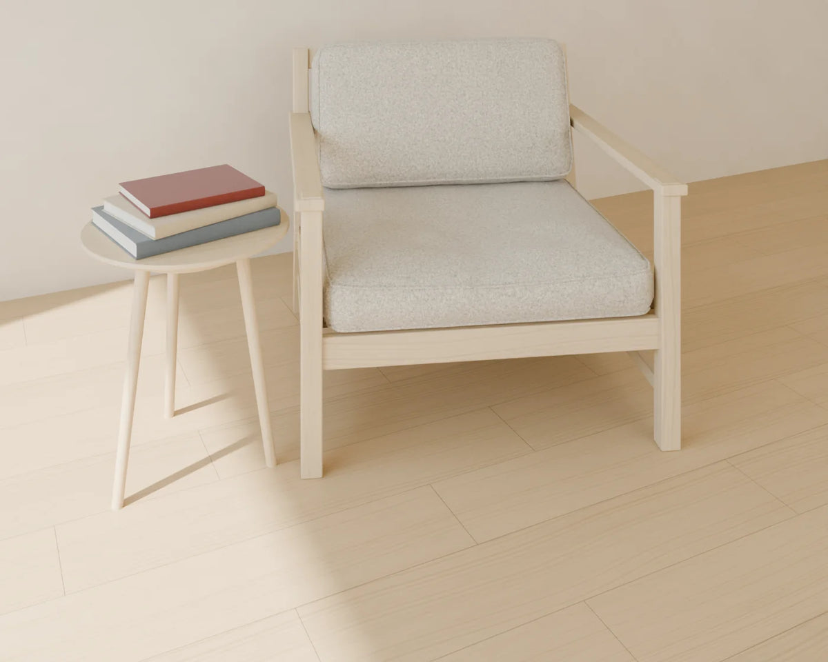 Coffee Table Book Stack styled in a Linden House room with the round side table and lounge armchair (sold separately)