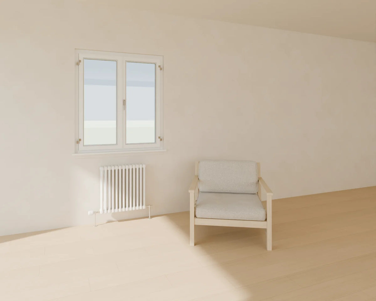 Column Radiator styled in a Linden House room with the casement window and lounge armchair (sold separately)