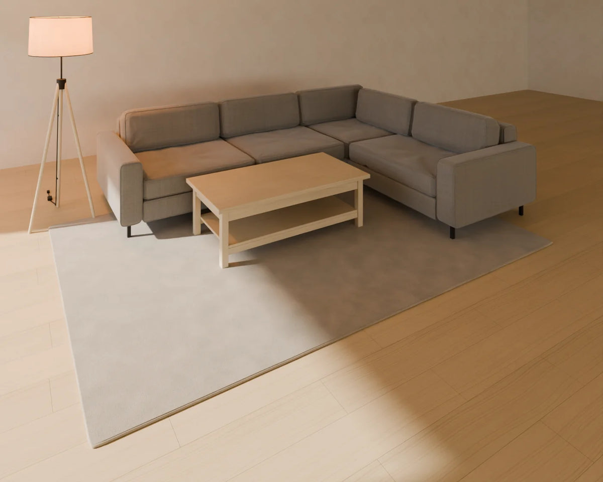 Corner Sofa styled in a Linden House room with the tufted wool rug, rectangular coffee table and tripod floor lamp (sold separately)