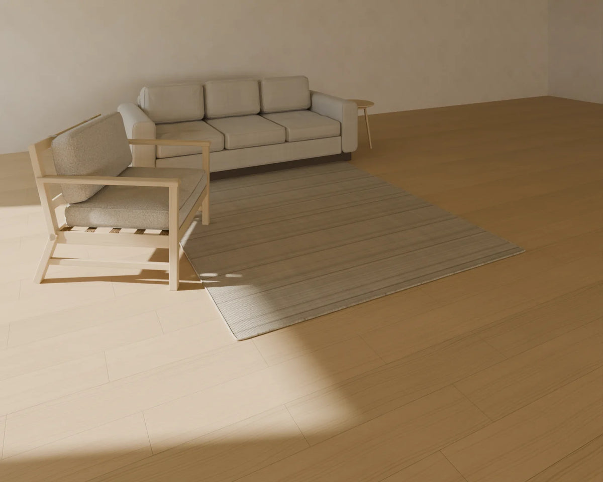Flatweave Wool Rug styled in a Linden House room with the three-seat sofa, round side table and lounge armchair (sold separately)