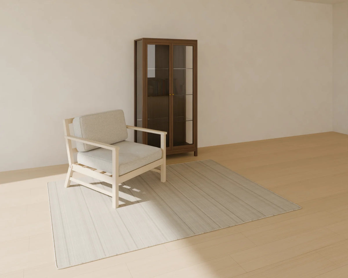 Glass Display Cabinet styled in a Linden House room with the book row, lounge armchair and flatweave wool rug (sold separately)