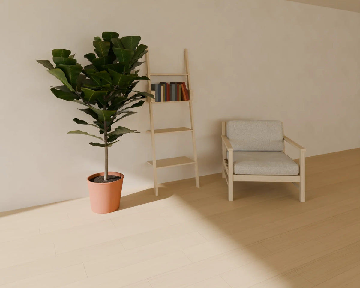 Leaning Ladder Shelf styled in a Linden House room with the book row, fiddle-leaf fig in planter and lounge armchair (sold separately)