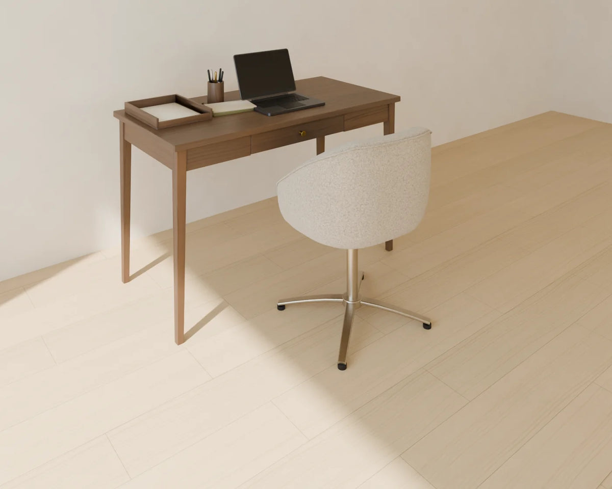 Open Laptop styled in a Linden House room with the writing desk, upholstered desk chair and desk accessories set (sold separately)