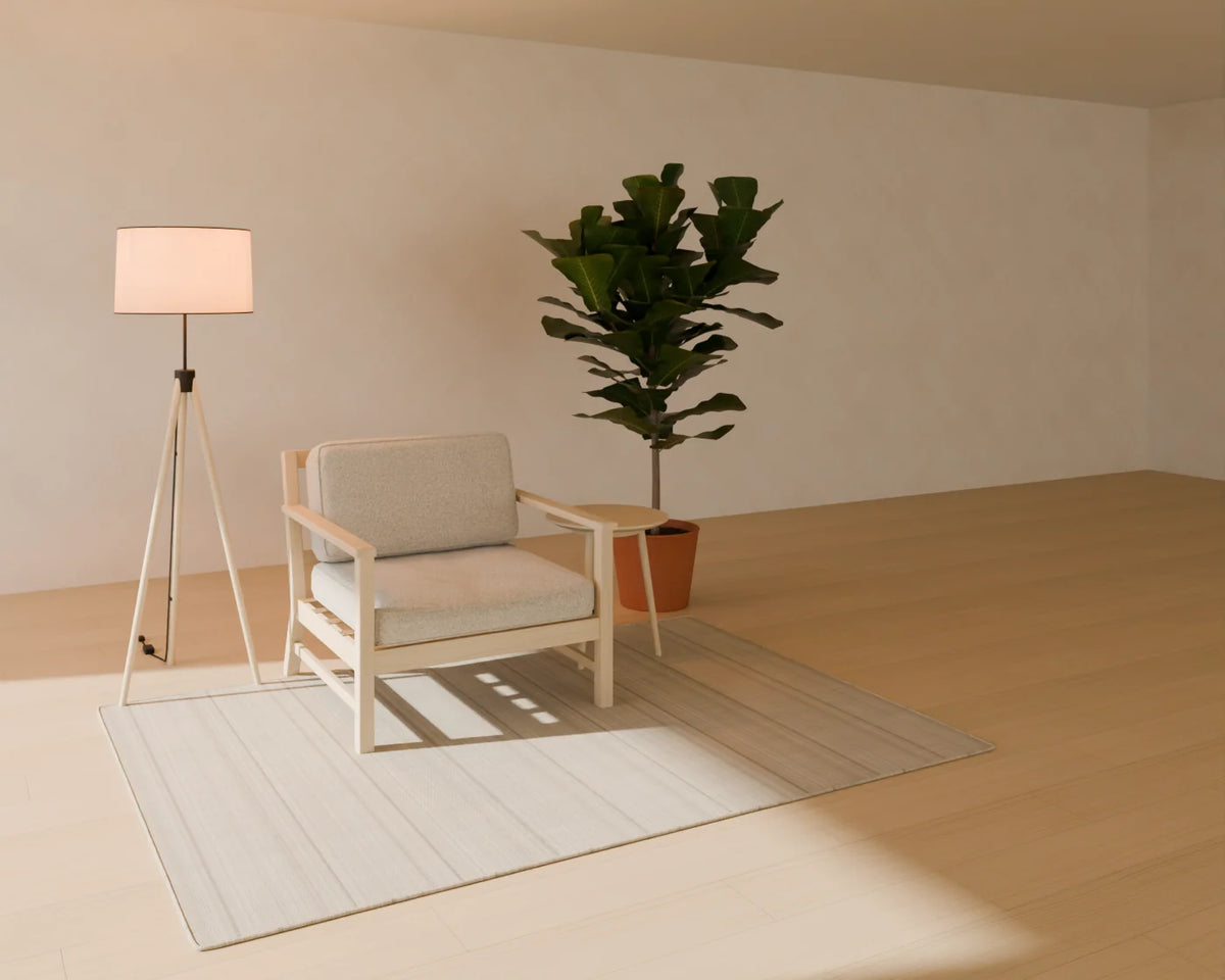Lounge Armchair styled in a Linden House room with the round side table, tripod floor lamp, flatweave wool rug and fiddle-leaf fig in planter (sold separately)