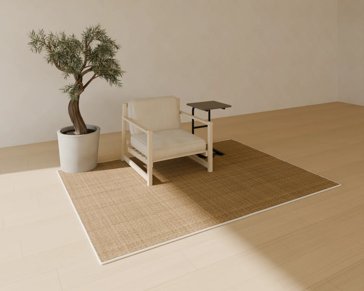 Low Timber Lounge Chair styled in a Linden House room with the jute rug, olive tree in planter and c-shaped side table (sold separately)