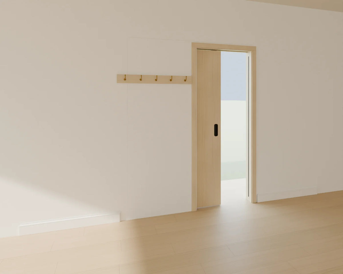 Pocket Sliding Door styled in a Linden House room with the skirting board and wall coat hooks (sold separately)