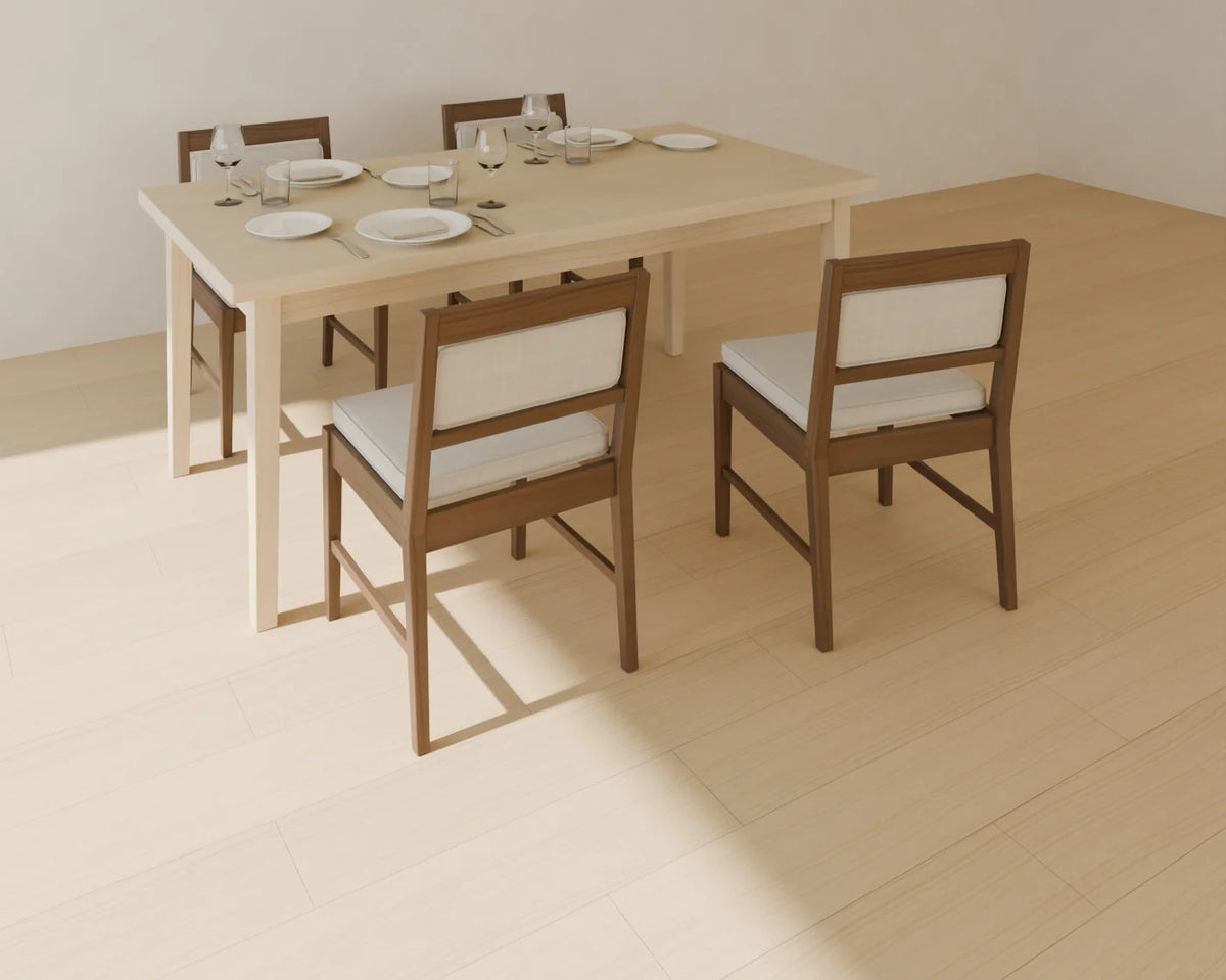 Rectangular Dining Table styled in a Linden House room with the upholstered dining chair and place setting (sold separately)