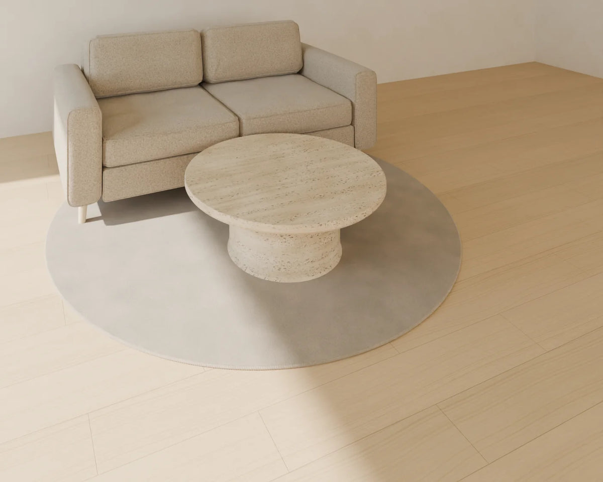 Round Stone Coffee Table styled in a Linden House room with the two-seat sofa and round rug (sold separately)