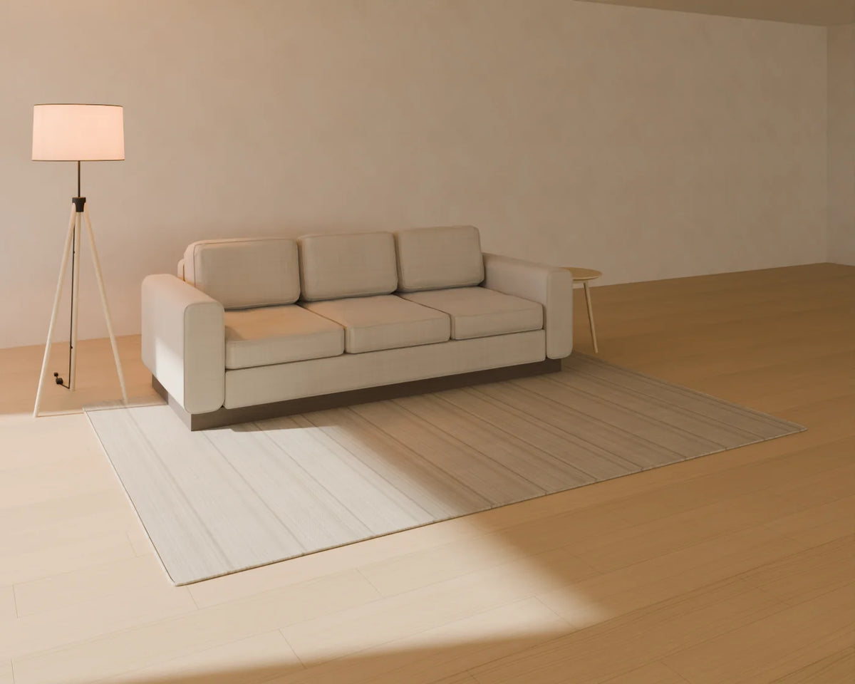 Three-Seat Sofa styled in a Linden House room with the flatweave wool rug, round side table and tripod floor lamp (sold separately)