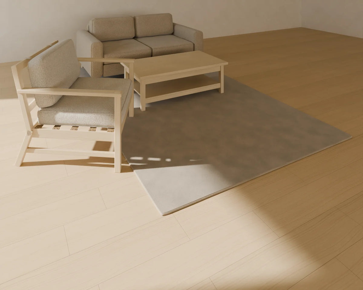 Tufted Wool Rug styled in a Linden House room with the two-seat sofa, rectangular coffee table and lounge armchair (sold separately)