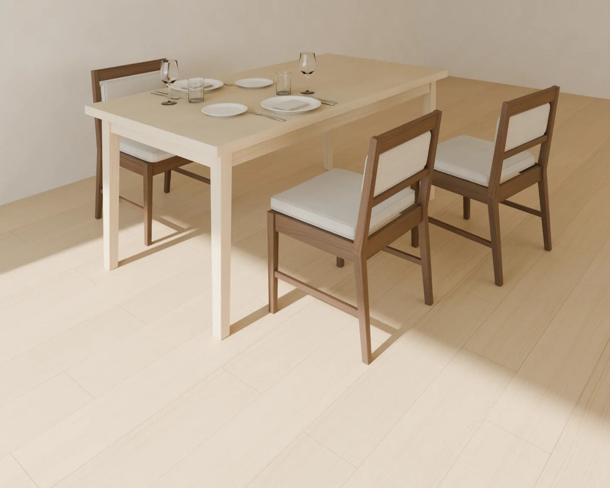 Upholstered Dining Chair styled in a Linden House room with the rectangular dining table and place setting (sold separately)