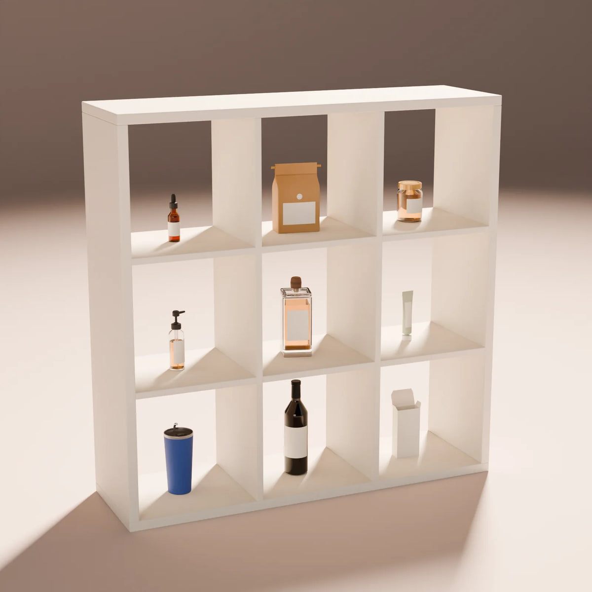Cube Display Shelf styled in a Still Studio set with the insulated tumbler, wine bottle, folding carton, pump bottle, spirits bottle, squeeze tube, dropper bottle, coffee bag and mason jar (sold separately)